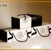 Funeral reception cardboard pack. Three boxes are stacked on top of each other, representing the front view and the back view of the box